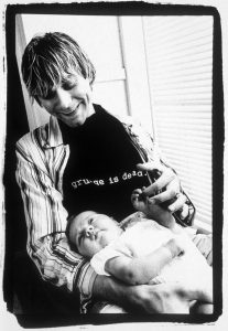 Kurt Cobain wearing 'Grunge is dead' tshirt and enjoying time with Frances Bean Cobain